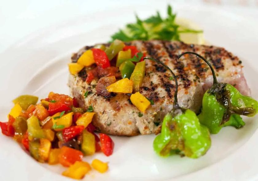 tuna steak served with herbs and spices